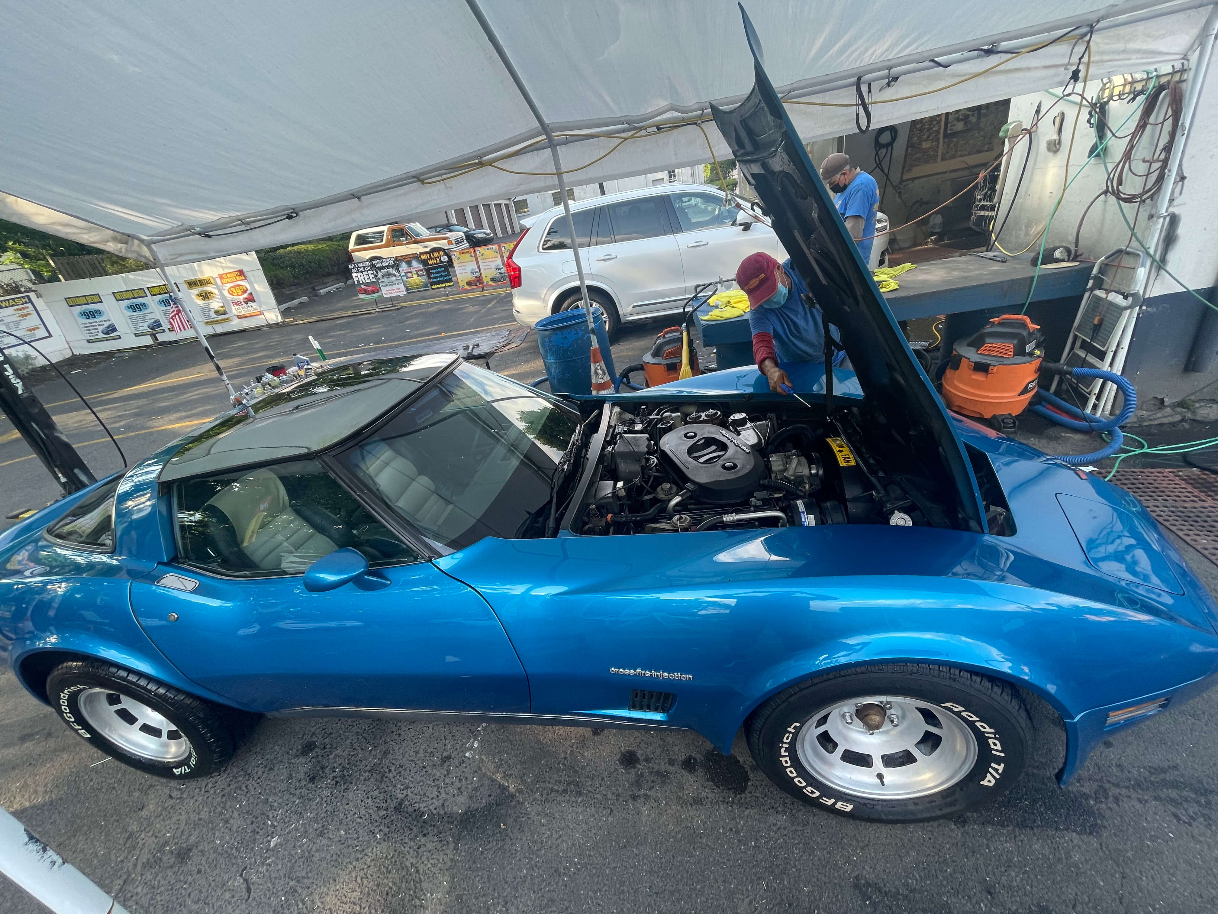 Engine bay detail on a classic Corvette at Teaneck Hand Car Wash